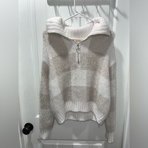 Zipper sweater. Zipper works great. Fuzzy.